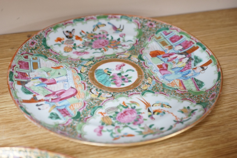 Five Chinese famille rose plates, Guangxu period and a pair of Chinese figures, 25cm in diameter. Condition - fair to good